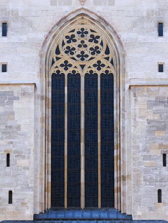 Antique narrow window on old building facade