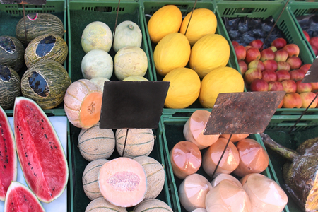 Organic fresh summer fruits on market stallの写真素材