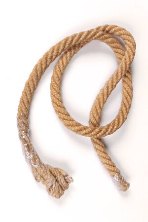 Old tied knot rope on white backgroundの写真素材
