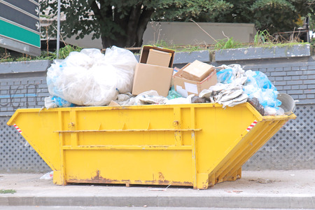 Large recycled material pile inside yellow containerの写真素材