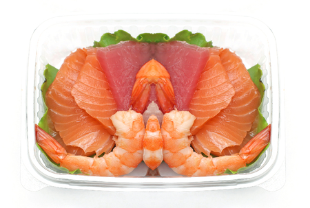 Assortment of fresh fish Japanese sashimi in plastic containerの写真素材