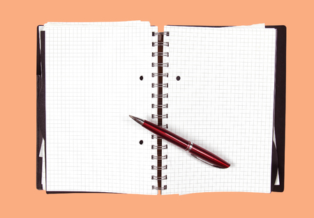 Open notebook with blank pages and pen insideの写真素材