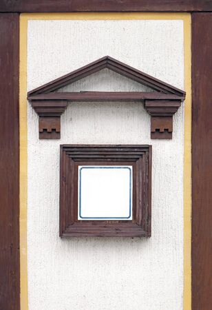 Empty info page square board on building facadeの写真素材