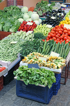 Fresh organic vegetables sold on small street market stallの写真素材