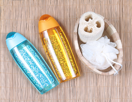 Bath sponges set with glittering toiletries containersの写真素材