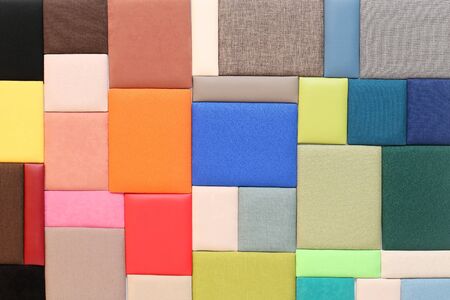 Bunch of upholstery materials textures samples on wallの写真素材
