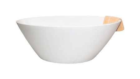 Modern oval bathtub with towel hanging from the edgeの写真素材