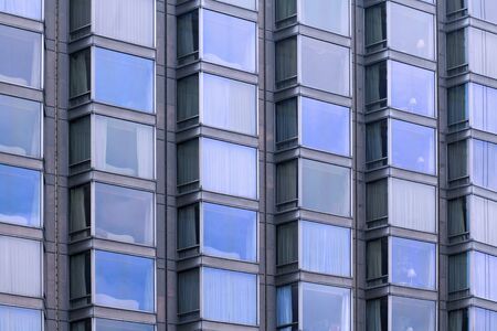 Abstract pattern of glass windows building facadeの写真素材