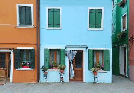 Retro houses with colorful facades and open doors and windowsの写真素材
