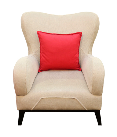 Retro armchair with beige textile and red decorative pillow isolated on whiteの写真素材