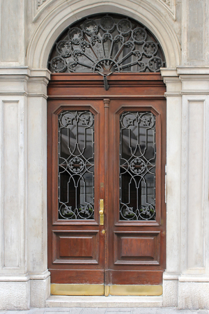 Old vintage closed door exterior with wooden and glass designの写真素材