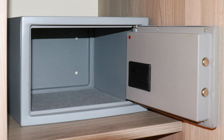 Small empty hotel safe with open doorの写真素材