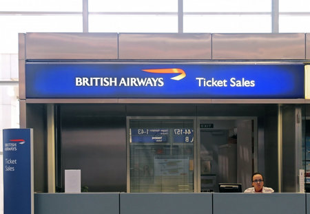 ATHENS, GREECE - MAY 05, 2015: British Airways airline ticket sales counter at Athens International Airport Eleftherios Venizelos with agent sitting behind the desk.のeditorial素材