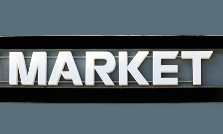 Market sign with white letters on grey wallの写真素材