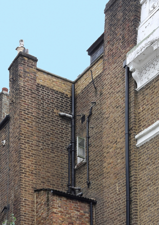 Old building with retro brick wall facade wallの写真素材