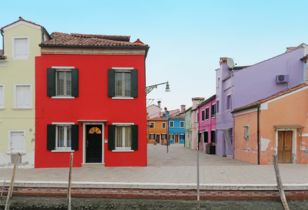 Street with colorful facade retro houses on Burano islandの写真素材