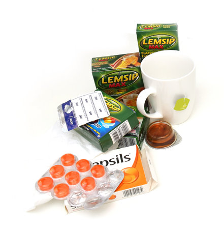 London, United Kingdom - January 23, 2016: Set of over the counter medicine and remedies for help with overcoming flu symptoms paracetamol, tea, pastilles...のeditorial素材