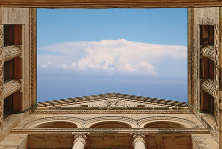 Clouds in sky seen through open roof of religious templeの写真素材