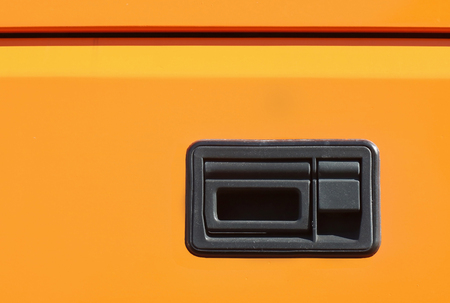 Car exterior door plastic handle on yellow color paintの写真素材