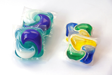 Colorful dish and laundry detergents on white backgroundの写真素材