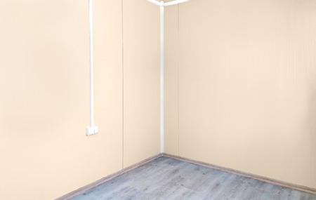 Empty room interior corner walls with wooden floorの写真素材
