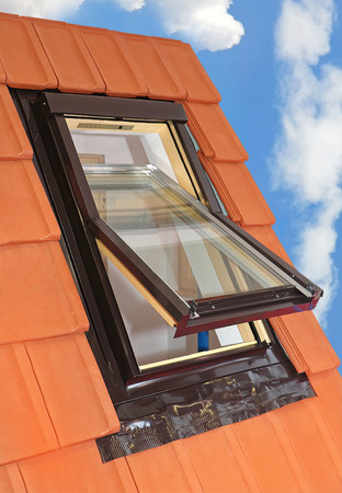 Open roof window with clouds sky on the sideの写真素材