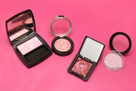 Modern beauty make up blush and eye shadow on pink backgroundの写真素材