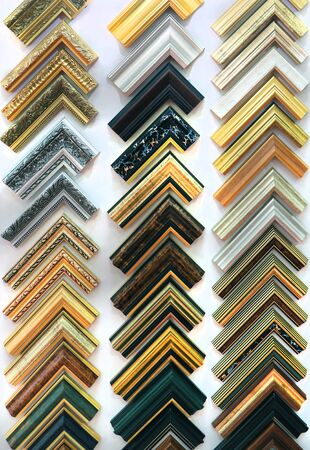 Many samples of frame corners on the wall of art shop