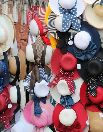 Colorful summer straw hats with ribbons and bows sold on marketの写真素材