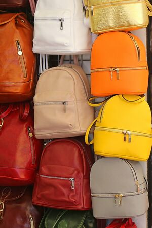 Colorful leather backpacks fashion accessories sold on street marketの写真素材