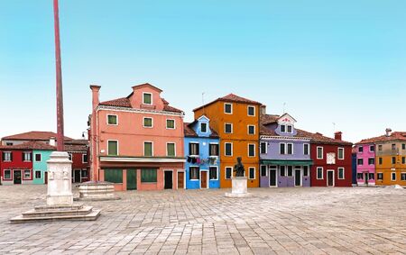 Small square with retro colorful facades houses on Burano Islandの写真素材
