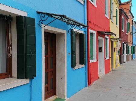 Colorful facade entrances of retro houses on a streetの写真素材