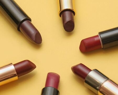 Selection of creamy red shades lipsticks arranged in a circleの写真素材