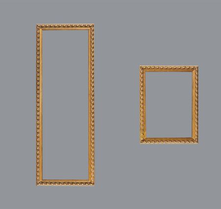 Two isolated gold rectangular shape empty framesの写真素材