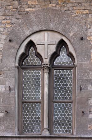 Old faded window exterior with stone facadeの写真素材