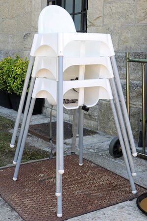 High plastic chairs for young children to use with dining tableの写真素材