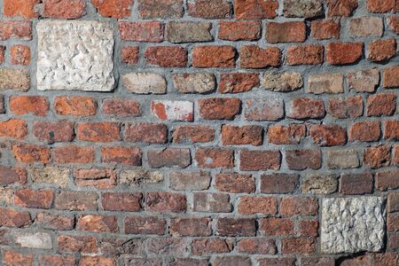 Old faded decayed brick wall pattern backgroundの写真素材