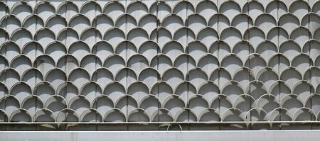 Closed metal fence exterior with decorative shapes patternの写真素材