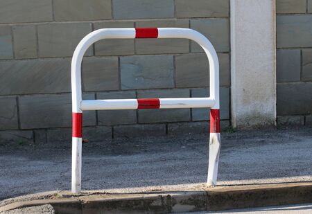 Metal bar on street used for parking bicycles and tie up with metal chain and padlockの写真素材