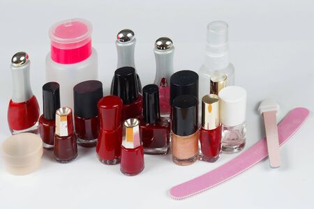 Set of colorful nail polishes in glass bottles and other manicure accessoriesの写真素材