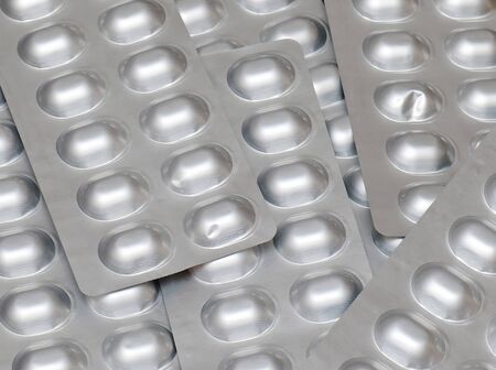 Medicine pills silver blisters pile pattern backgroundの写真素材