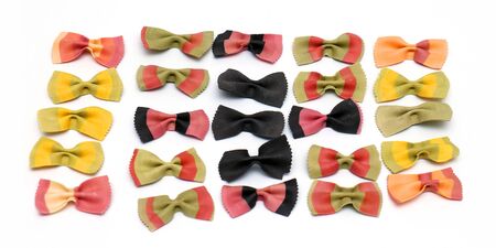 Raw colorful decorative pasta in bow shape on white backgroundの写真素材