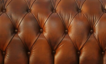 Retro brown leather material on chesterfield style sofa texture backgroundの写真素材