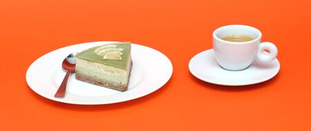 Raw cake on plate and espresso on orange backgroundの写真素材