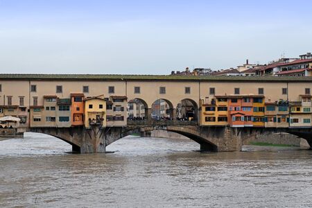 Ancient landmark Ponte Vecchio over Arno river in Florenceの写真素材