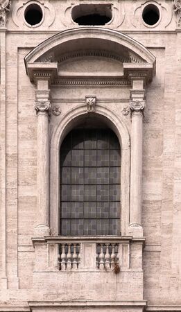 Old window architecture on stone facade building exteriorの写真素材