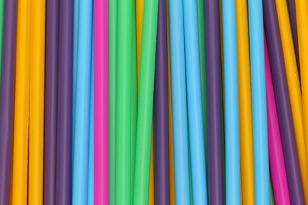 Vivid colorful plastic drinking straws background patternの写真素材