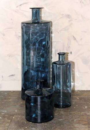 Modern home decor blue glass vases and closed bowl on tableの写真素材
