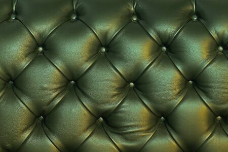 Green leather material furniture upholstery pattern backgroundの写真素材