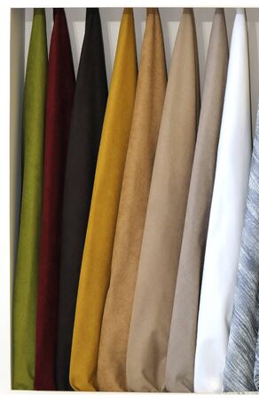Textile different materials samples used in various industries hanging on wallの写真素材